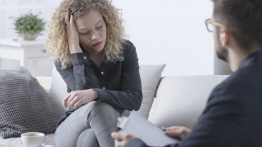 Worried woman during psychotherapy
